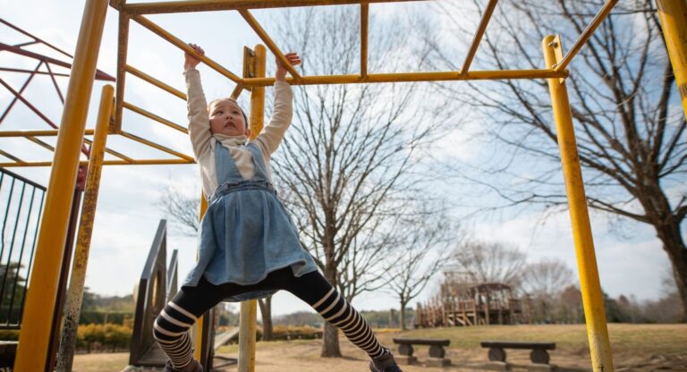 girl on the monkey bars